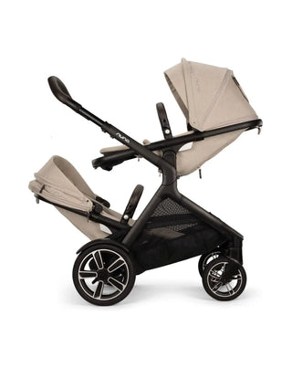 Beige and black stroller with two seats on a white background