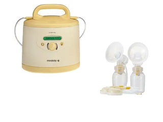 Cream and yellow breast pump with dual silicone cups, medela brand.
